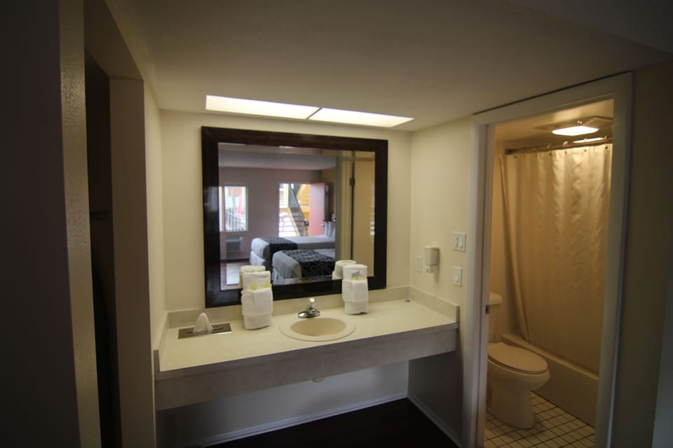 Classic Double Room, 2 Queen Beds | Bathroom | Free toiletries, hair dryer, soap, shampoo