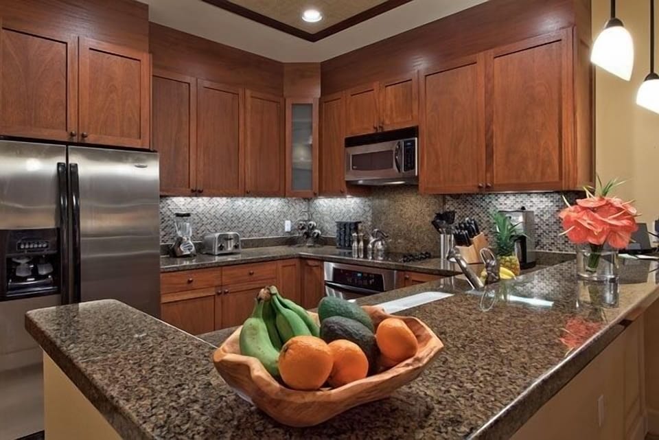 Open design kitchen with warm wood cabinets.