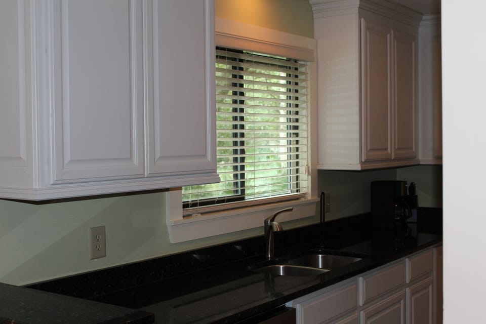 kitchen, granite counters, stocked with pots, pans, utensils, bake ware, ect..