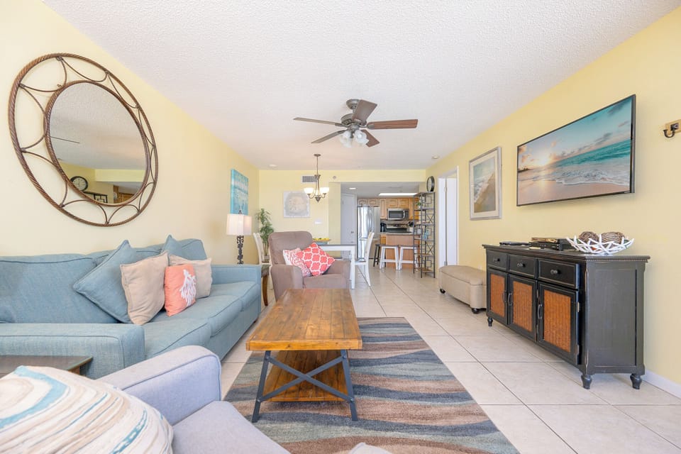 Sink into the plush chair and catch a movie with your family in this cozy living room space