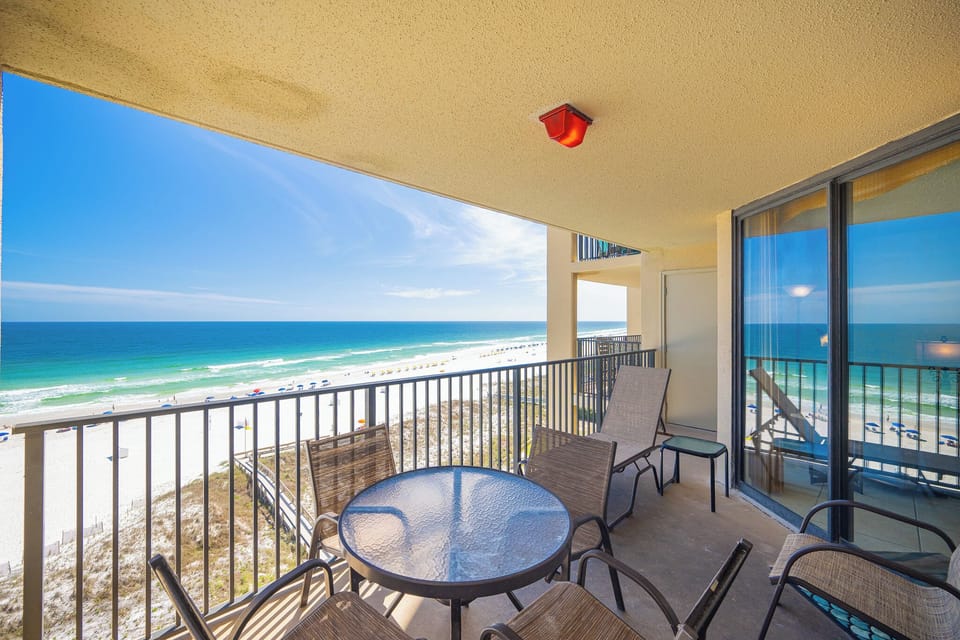 Your balcony offers gentle gulf breezes as you relax on loungers and watch waves roll onto the shore