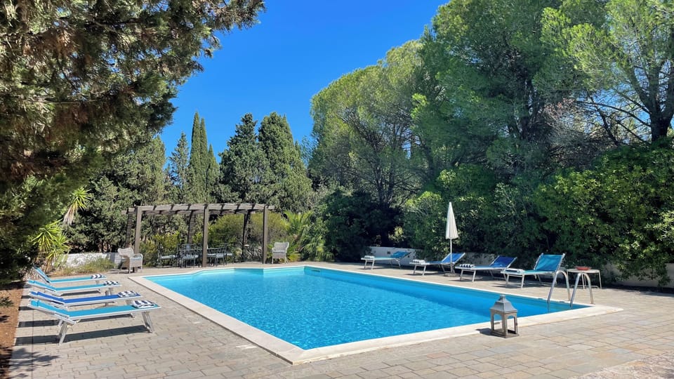Professional pool crew maintains the pool clean twice weekly.