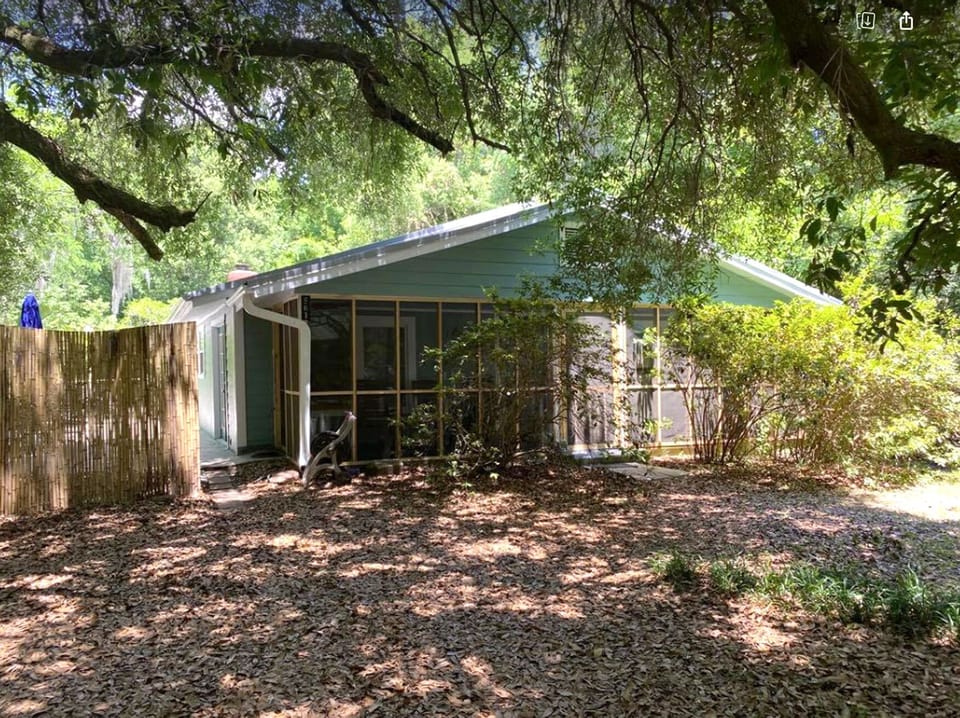 Relax on the screened in front porch with rocking chairs.