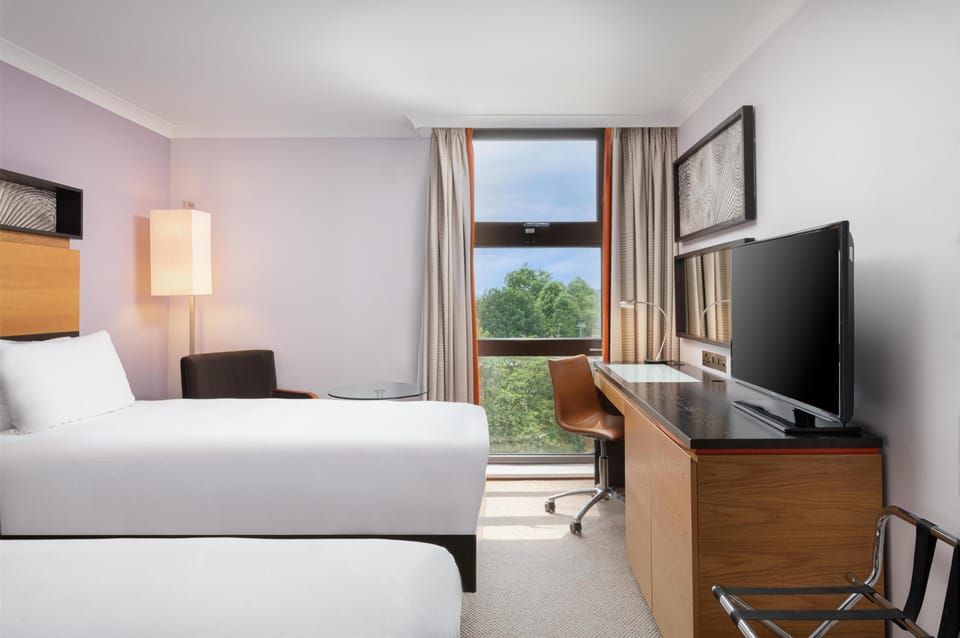 Twin Hilton Guest Room | Premium bedding, down comforters, in-room safe, desk