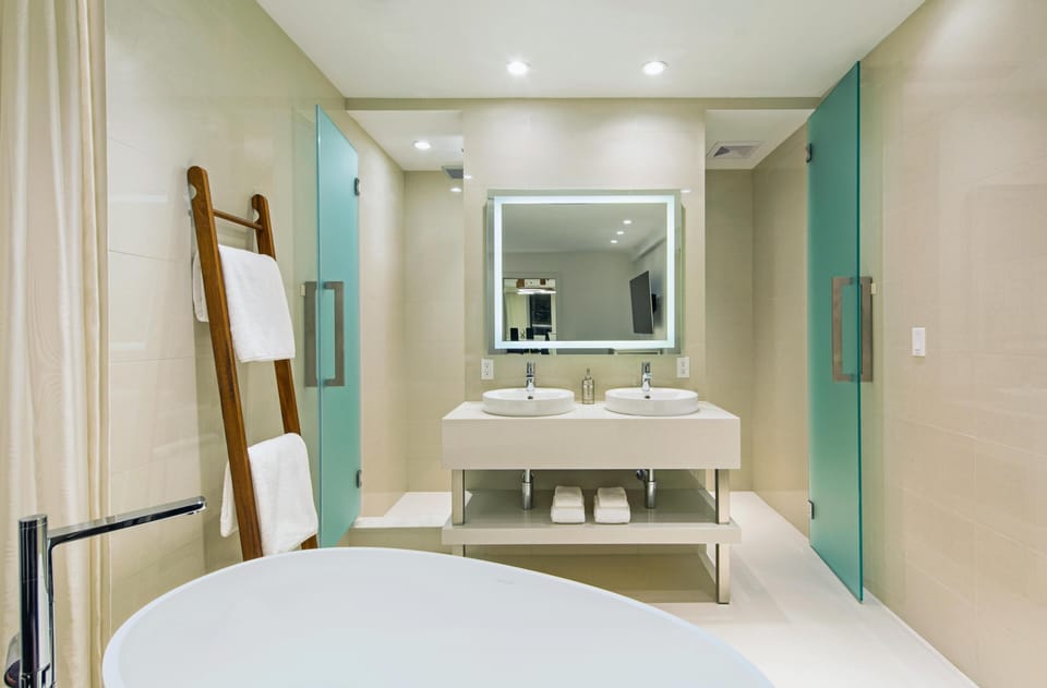 Shower, designer toiletries, hair dryer, bathrobes