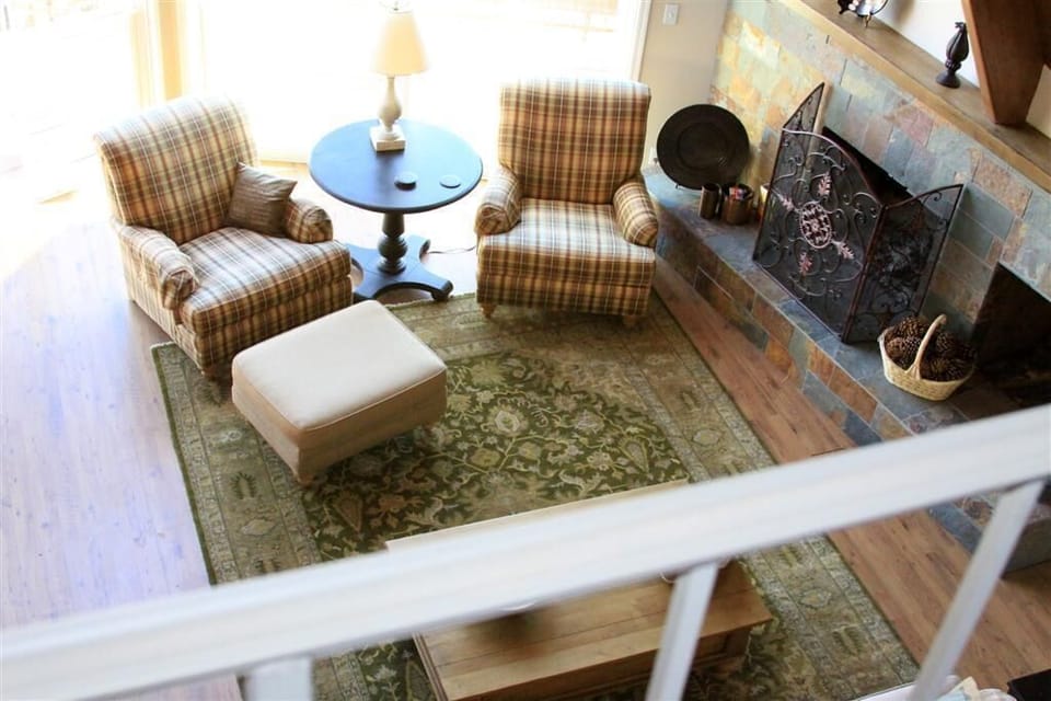 A view from the loft looking down at the living room area.
