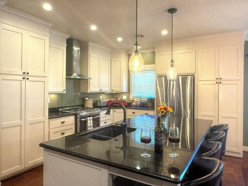 Kitchen: Granite counters, large island with seating for 4, stainless steel app.
