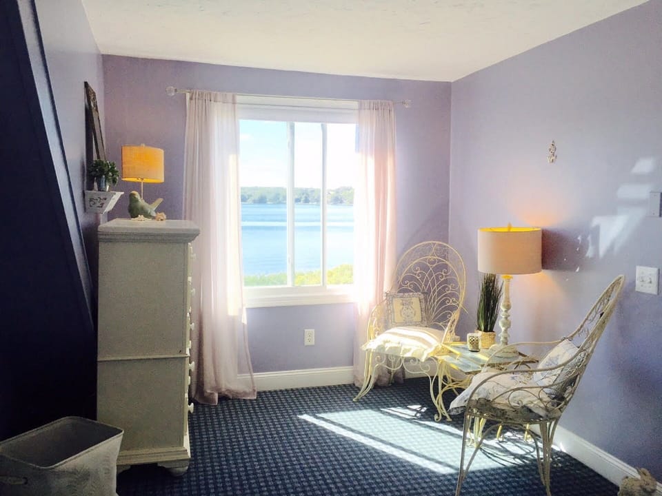 Beachfront views from the sitting area of this bedroom.