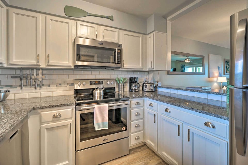 Kitchen: Deep SS sink, beveled subway tile, under cabinet lighting