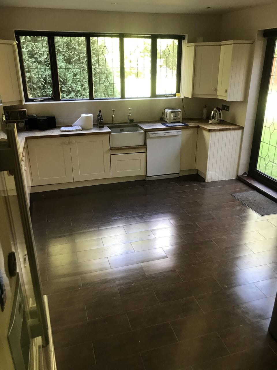 Beautiful kitchen with French doors leading to garden.