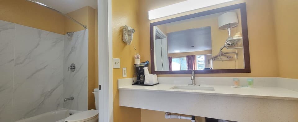 Deluxe Room, 2 Queen Beds, Non Smoking | Bathroom | Free toiletries, hair dryer, towels, soap