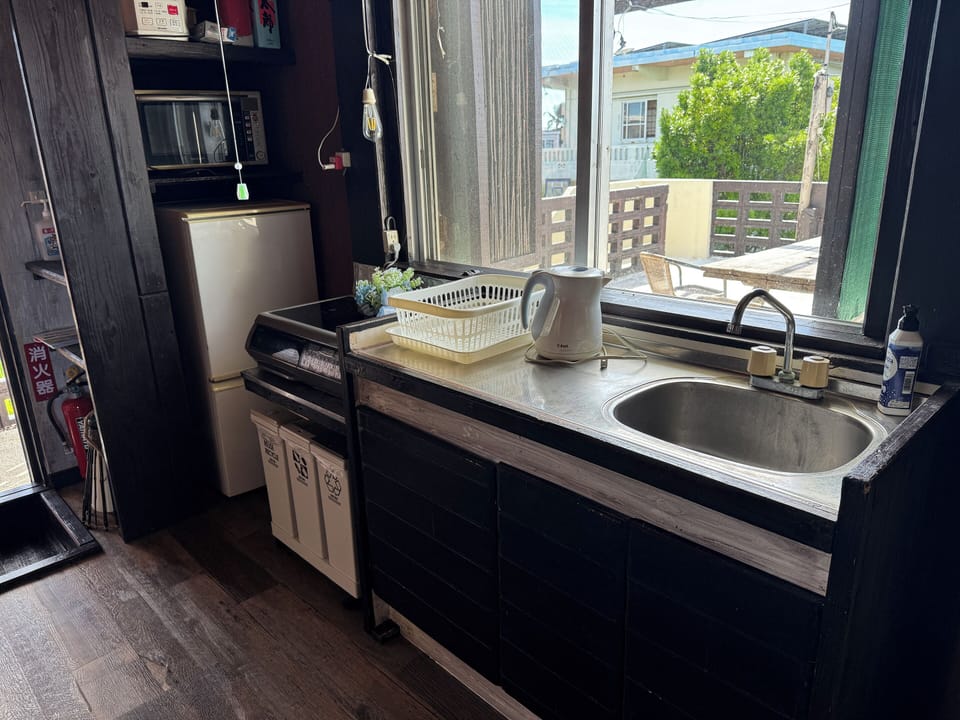 Full-size fridge, microwave, stovetop, rice cooker