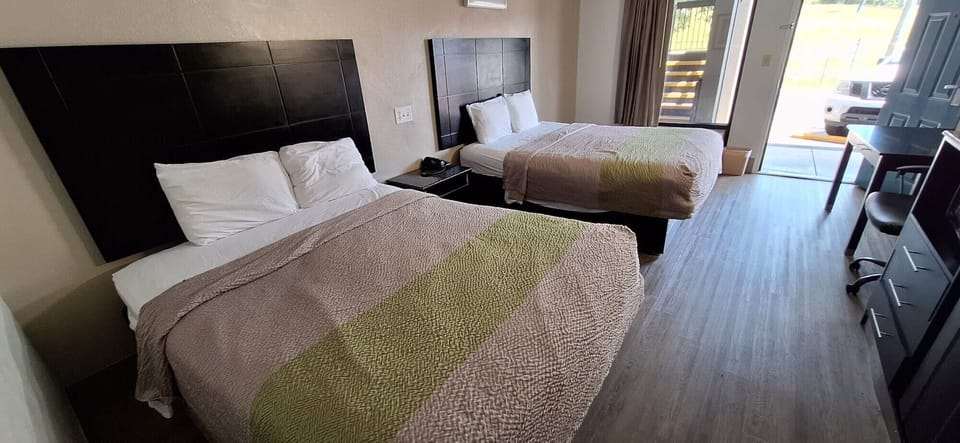 Premium bedding, desk, blackout drapes, iron/ironing board