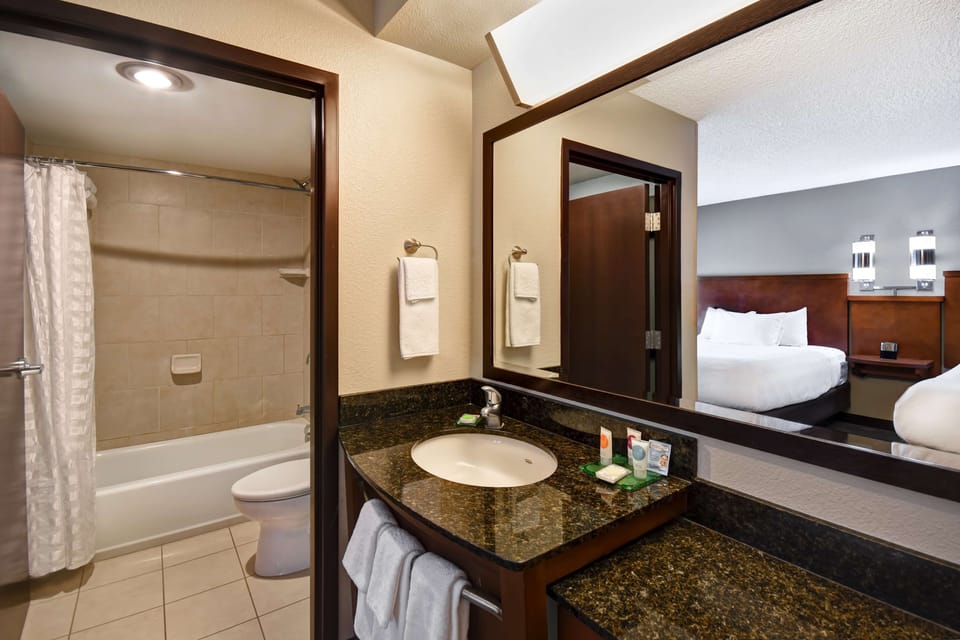 Designer toiletries, hair dryer, towels