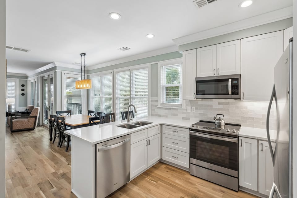 Cook memorable meals in your bright, fully-equipped kitchen with stainless steel appliances, ample counter space, and island seating.