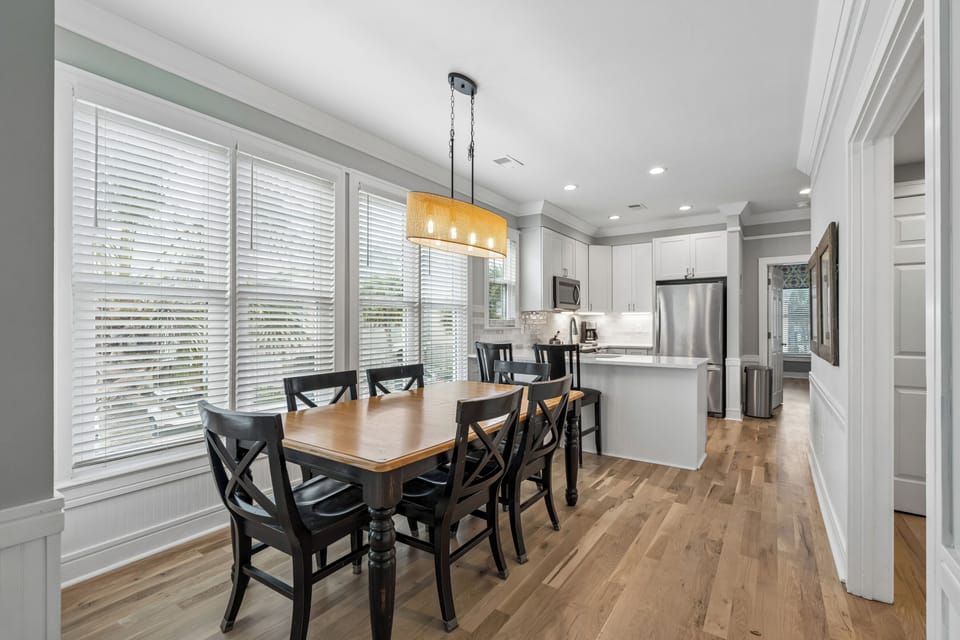 Your bright, open-concept dining and kitchen area features modern appliances and warm wood floors for memorable meal times.