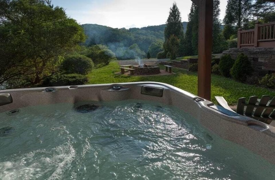 Hot Tub overlooking the mountaintops and the private pond