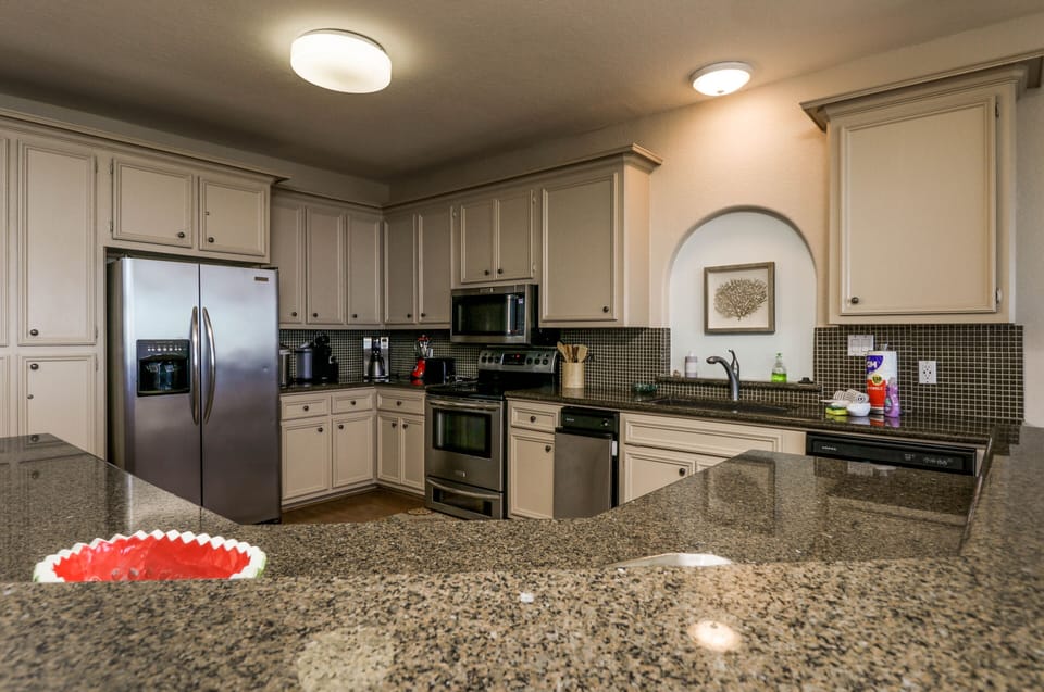 Kitchen equipped with Keurig, toaster, blender, microwave