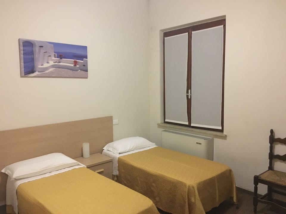 Economy Twin Room | Minibar, in-room safe, desk, rollaway beds