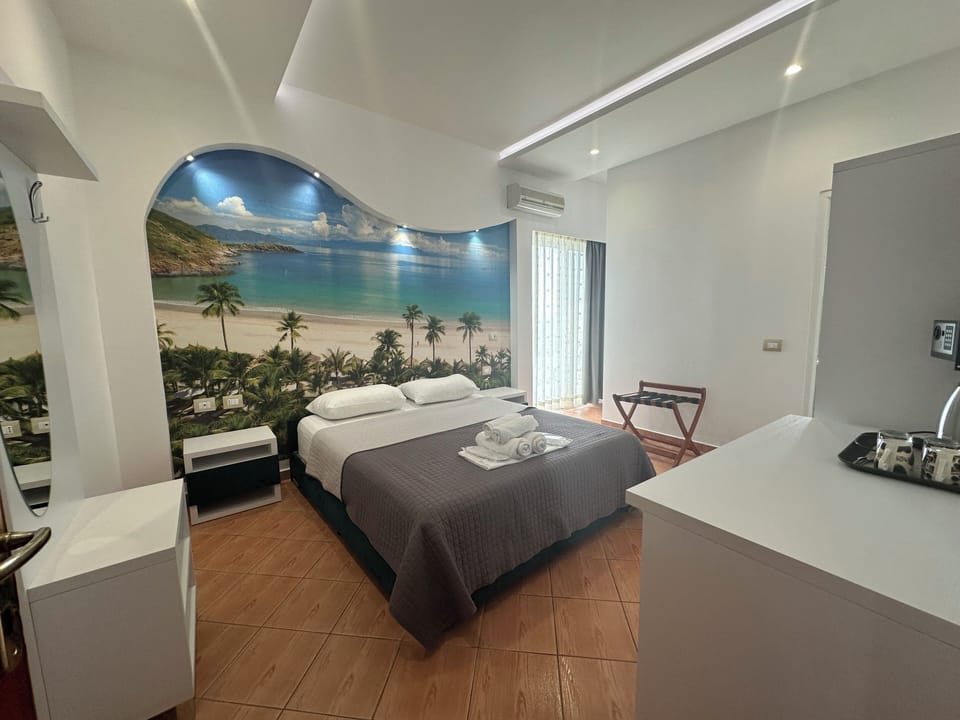 Deluxe Triple Room, Sea View | In-room safe, desk, soundproofing, iron/ironing board