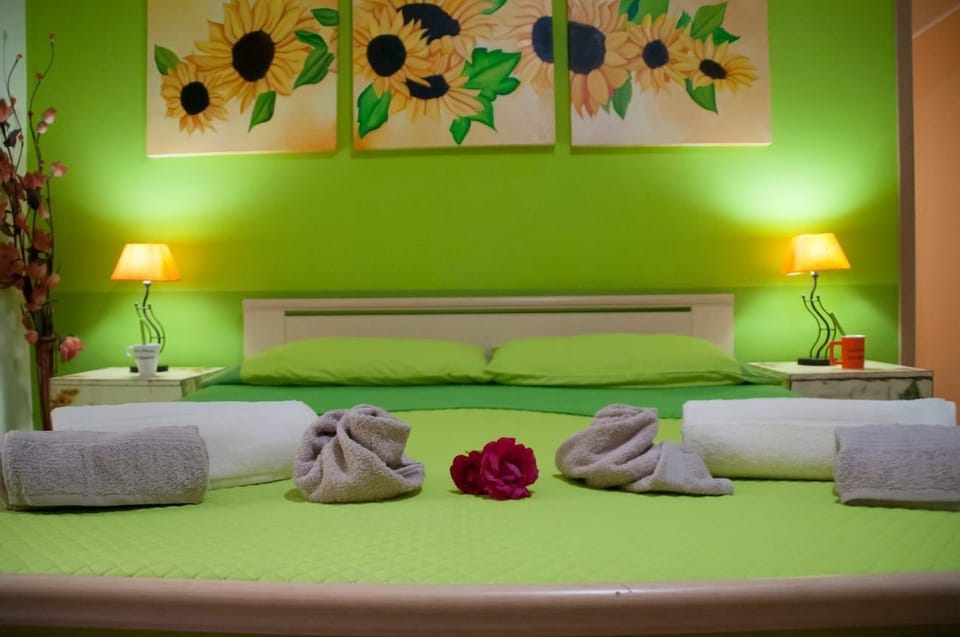 Family Quadruple Room | 1 bedroom, blackout drapes, free WiFi, bed sheets