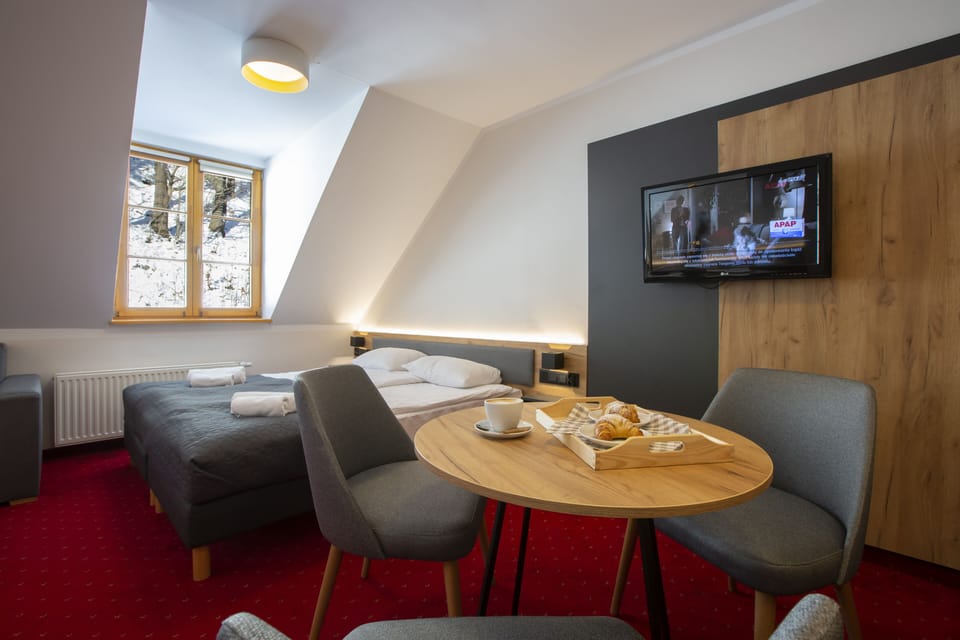 Family Quadruple Room, Non Smoking | In-room safe, desk, laptop workspace, iron/ironing board