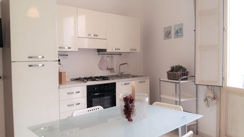 Family Apartment, 1 Bedroom | Private kitchenette | Stovetop, cookware/dishes/utensils, freezer