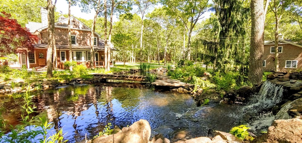 Koi Pond view  of side house and detached Garage w 800 sq' Studio Loft 9 Acres 