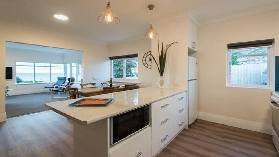Kitchen thru Dining room to front lounge.