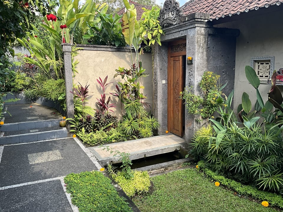 Walk over a coy pond through your front door to paradise within!
