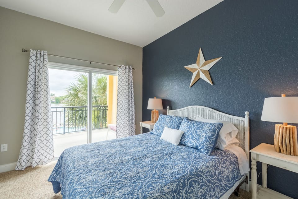 Lovely second bedroom has access to the large balcony and sweeping water views