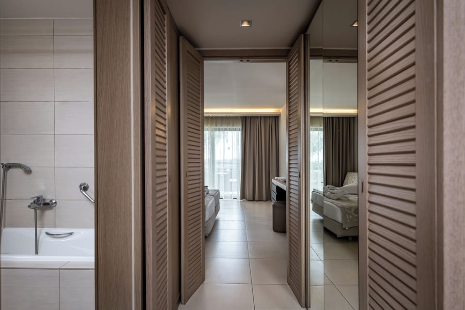 Designer toiletries, hair dryer, bathrobes, slippers
