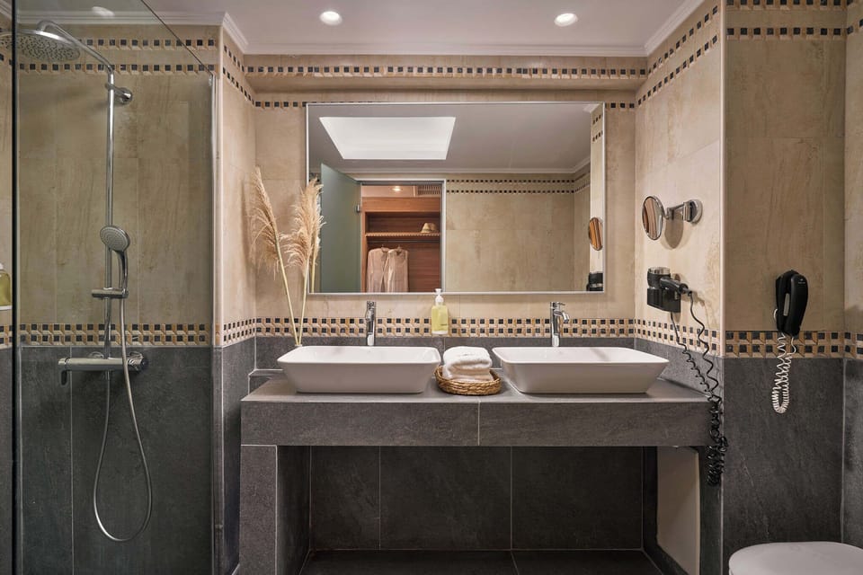 Eco-friendly toiletries, hair dryer, slippers, towels