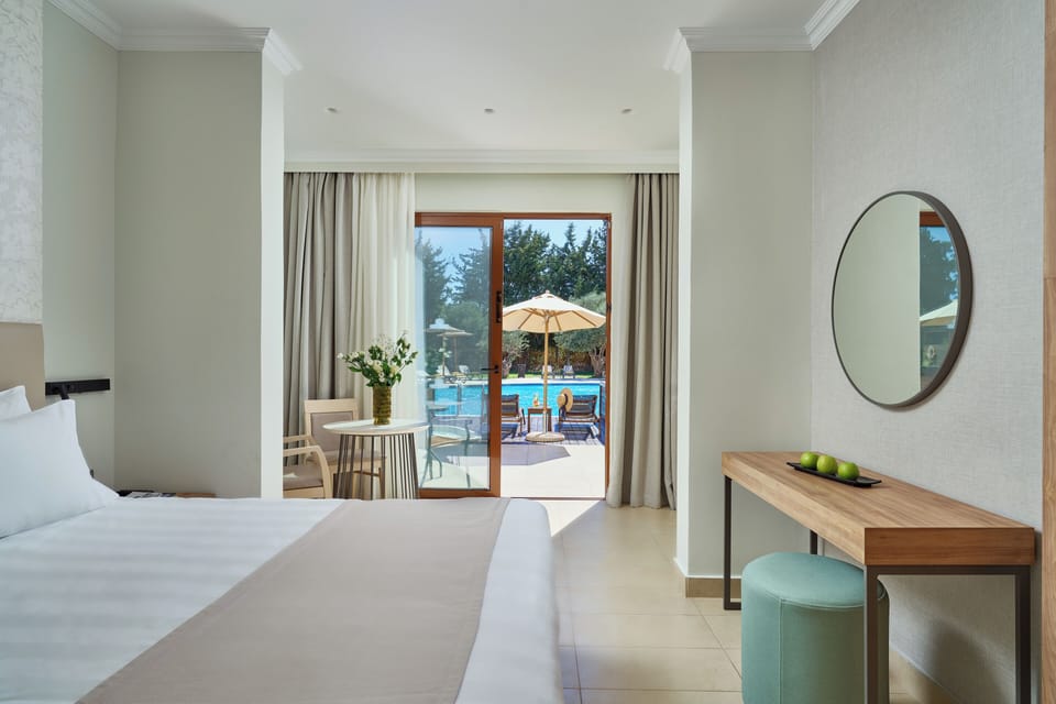 Suite, Jetted Tub, Garden View (Sharing Pool) | Minibar, in-room safe, individually decorated, individually furnished