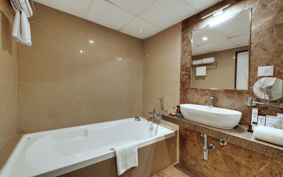 Suite | Bathroom | Separate tub and shower, rainfall showerhead, free toiletries, towels