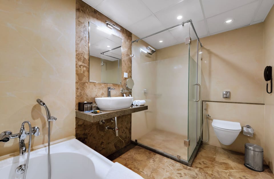 Suite | Bathroom | Separate tub and shower, rainfall showerhead, free toiletries, towels