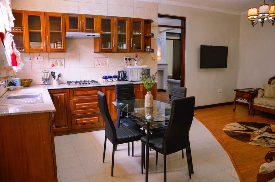 Apartment, 2 Bedrooms | Private kitchen | Fridge, microwave, stovetop, coffee/tea maker