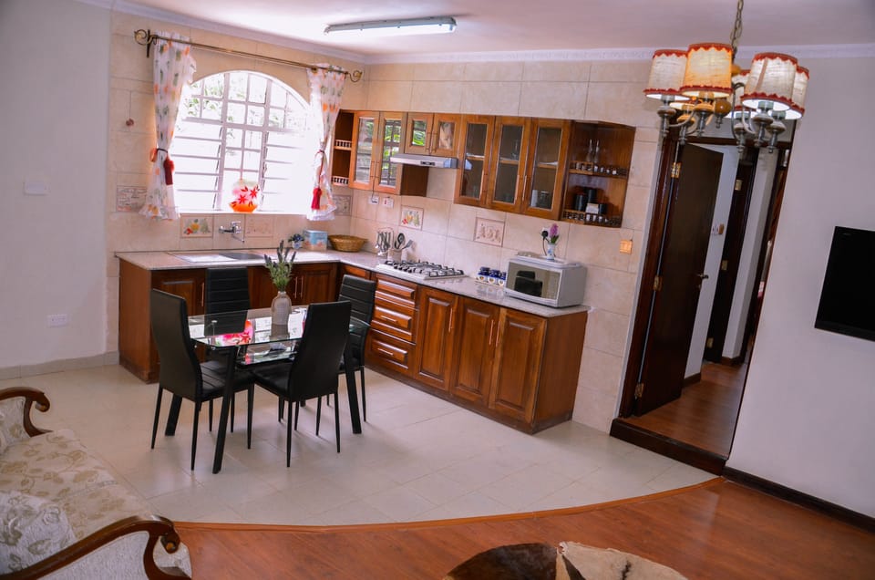 Apartment, 2 Bedrooms | Private kitchen | Fridge, microwave, stovetop, coffee/tea maker