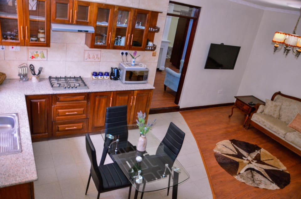 Apartment, 2 Bedrooms | Private kitchen | Fridge, microwave, stovetop, coffee/tea maker