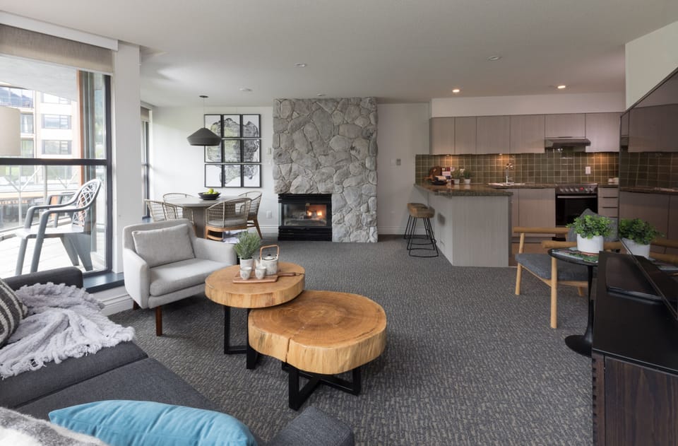 Suite, 2 Bedrooms | Living room | 49-inch LED TV with cable channels, TV, foosball