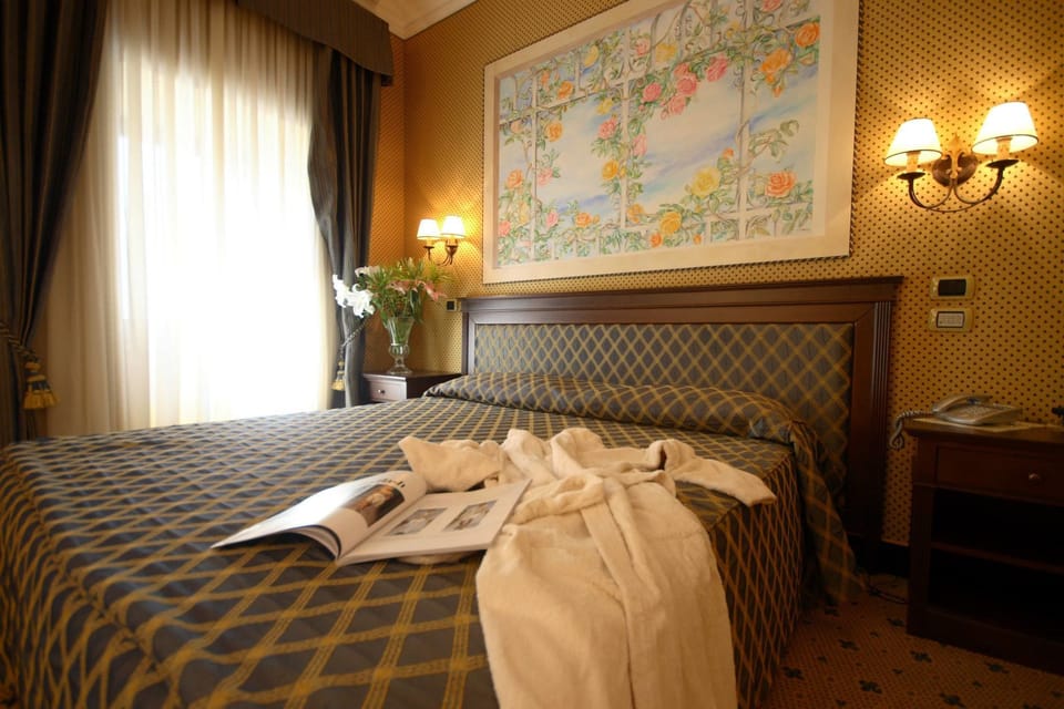 Standard Double Room | Minibar, in-room safe, desk, blackout drapes