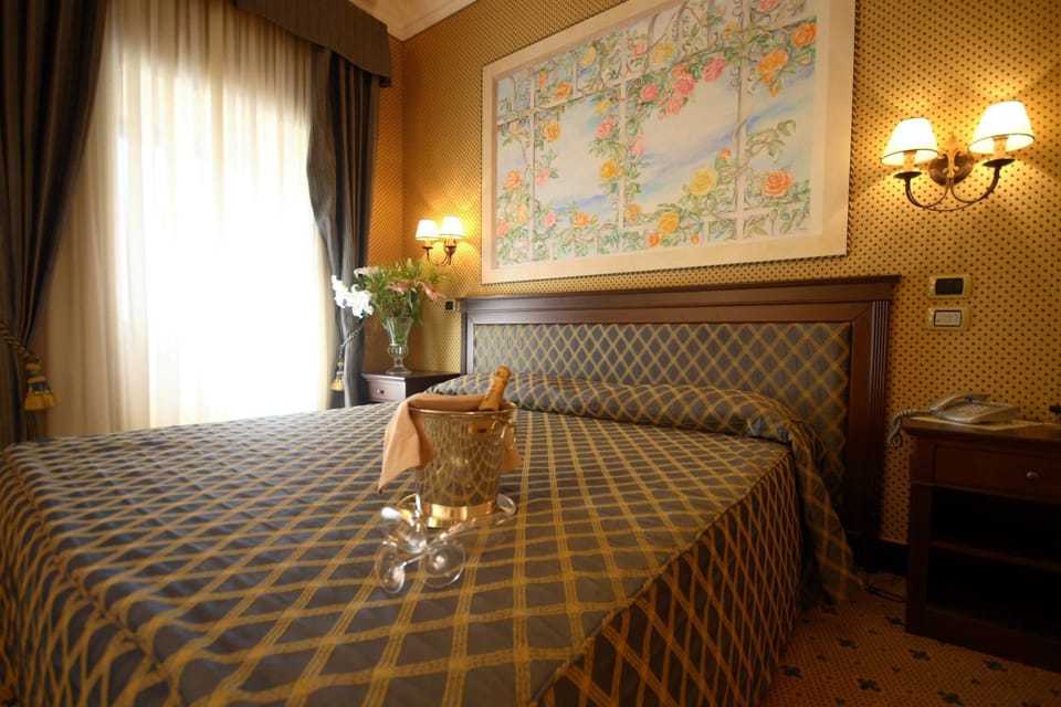 Standard Double Room | Minibar, in-room safe, desk, blackout drapes