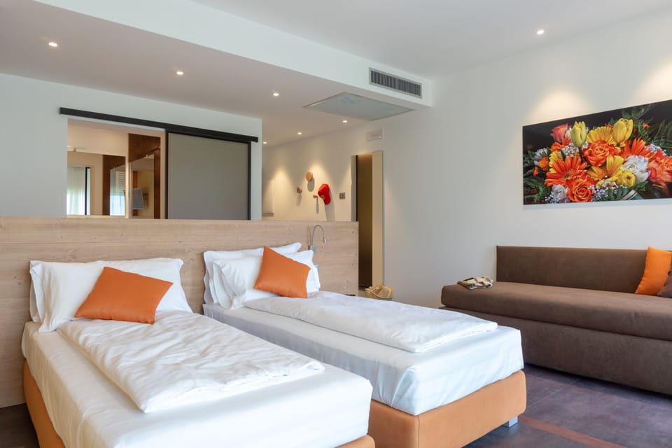 Deluxe Triple Room, Multiple Beds | Premium bedding, down comforters, minibar, in-room safe
