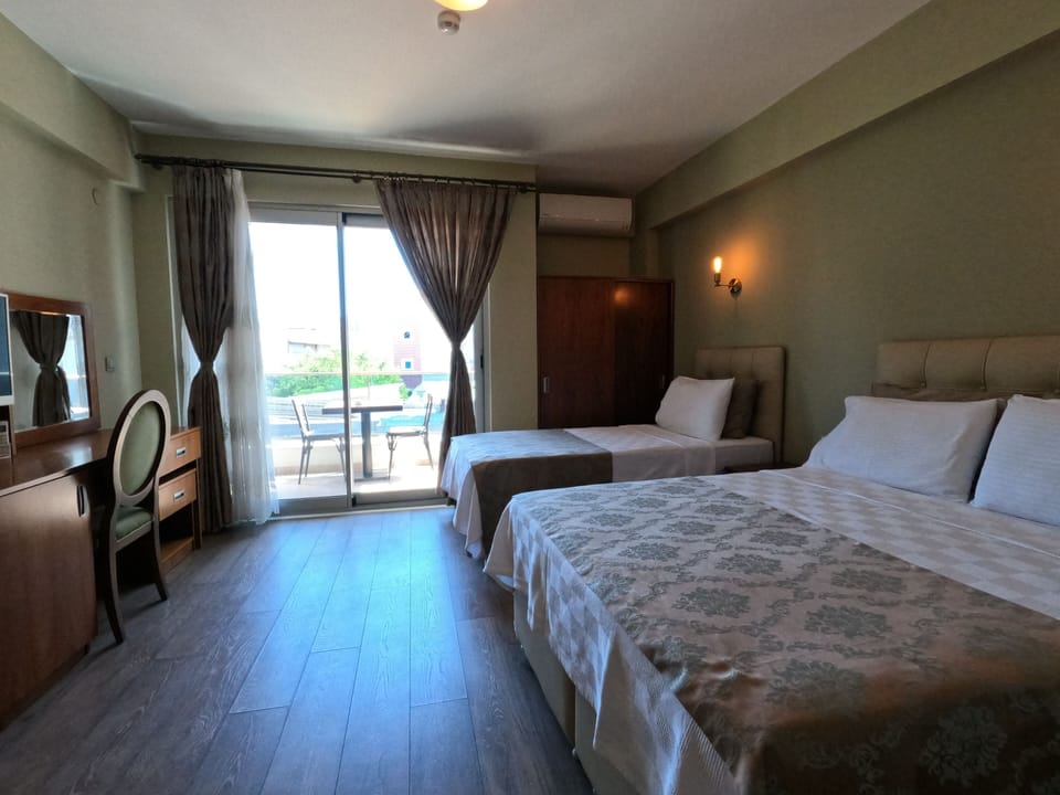 Deluxe Triple Room, Partial Sea View | In-room safe, soundproofing, cribs (free), WiFi (free)