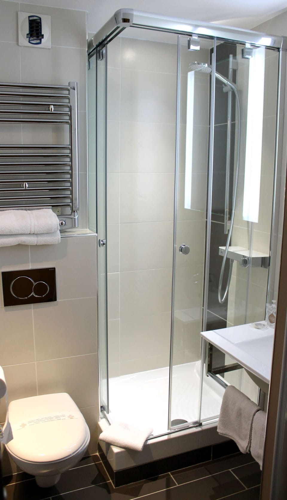 Shower, eco-friendly toiletries, hair dryer, towels
