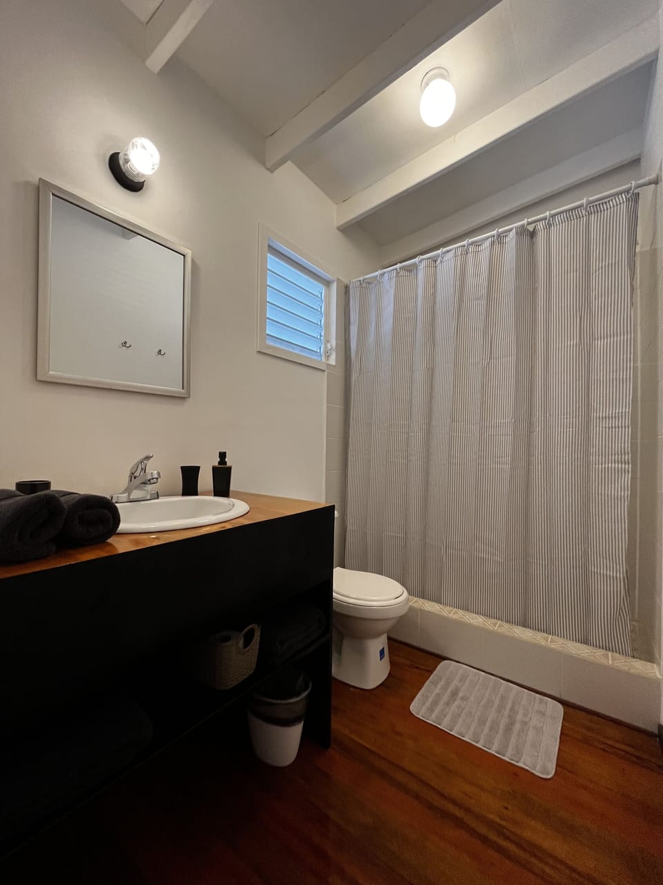 Shower, rainfall showerhead, towels, soap