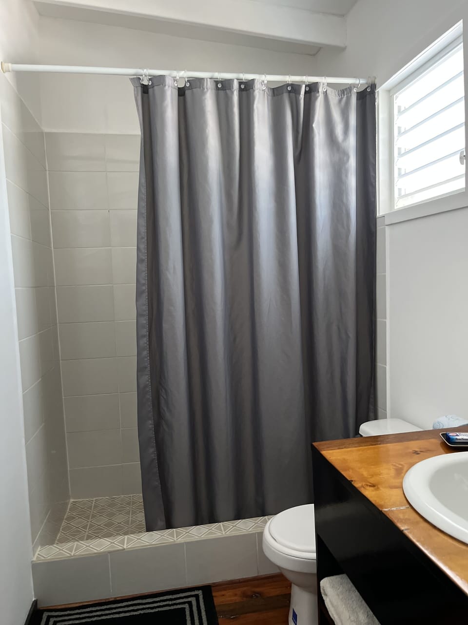 Shower, rainfall showerhead, towels, soap