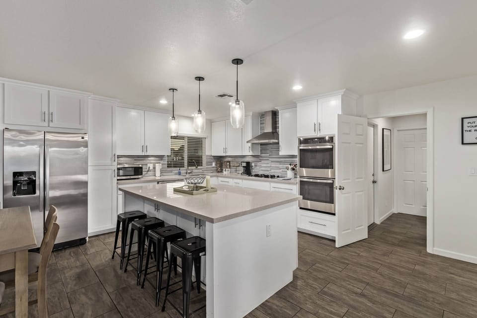Enjoy the double ovens, gas stove, microwave, cookware, utensils & traditional coffee maker