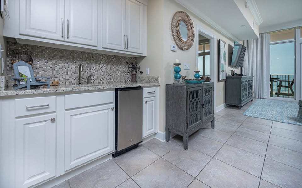 Prepare drinks at the stylish wet bar with an ice maker and decorative accents for a welcoming vibe