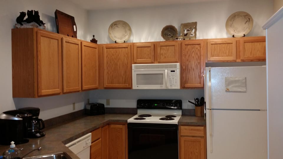 Kitchen is fully stocked and features both a regular coffee maker and a Keurig.